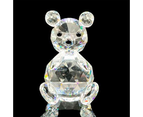 A clear faceted figure of a bear with black eyes and nose. Swarovski mark. This item has its original box: 3.25"W x 4.5"H. Ar