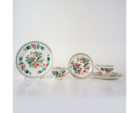 Colorful floral and bird design with gilt edge. Includes 2 dessert plates, 2 cups, and 2 saucers. Aynsley backstamp. Largest 