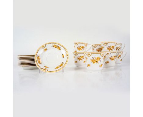 Bone china decorated with orange, brown, and yellow flowers and bands on white ground with orange rim. Includes 10 cups and 1