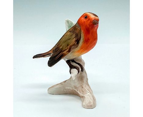 Small red and brown robin perched ontop of a pale brown branch. Goebel backstamp and sticker. Issued: 1972 to 1979Dimensions: