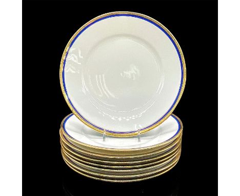 Eight white plates with elegant cobalt blue ring and gold scroll design on the rim. Richard Ginori backstamp. Dimensions: 1"H