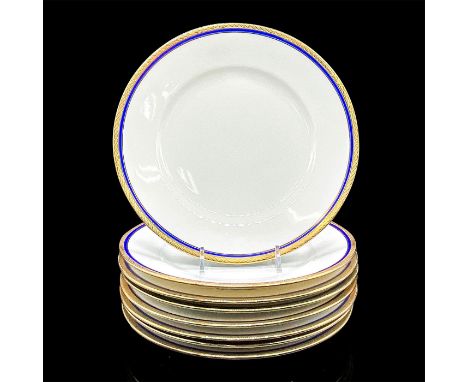 Eight white plates with elegant cobalt blue ring and gold scroll design on the rim. Richard Ginori backstamp. Dimensions: 1"H