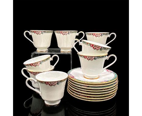 Eight bone china tea cups and eight saucers with a lively green, purple, blue and mauve floral and fruit design, gold rim. Ro