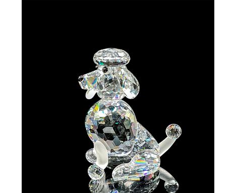 Brilliant clear crystal miniature sitting poodle figurine. Swarovski backstamp. This item has its original box: 4"H x 3.5"D. 