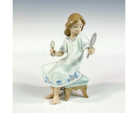 Glossy finish; Lladro backstamp. Artist: Francisco PolopeIssued: 1990 - 1997Dimensions: 4"L x 3.5"W x 6.25"HManufacturer: Lla