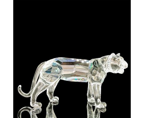 A clear faceted body of an apex predator with tawny eyes. Swarovski mark. This item has its original box: 8"L x 7.5"W x 3.25"
