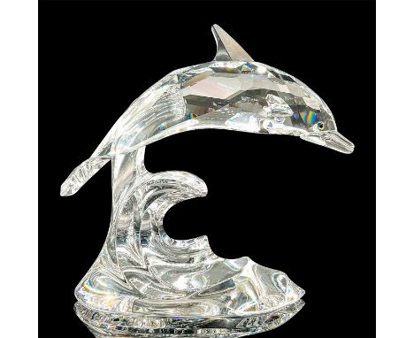 Brilliant clear crystal figure of a happy dolphin riding a wave on its tail. Item number 190365. Swarovski etched mark. Inclu