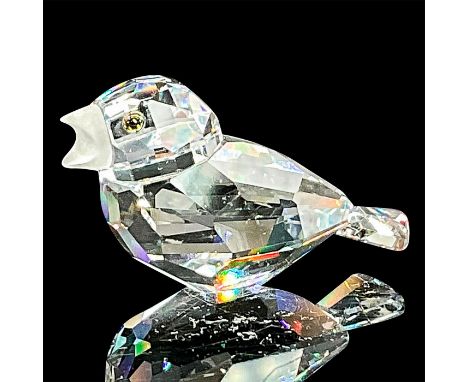 A clear faceted body with a frosted beak and tawny eyes. Swarovski mark. This item has its original box: 3.25"W x 2.25"H. Art