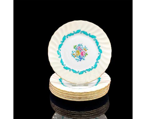 Six white and cream plates with floral and blue leaf design, gold rim. Royal Minton backstamp. Dimensions: 0.5"H x 6.25" diaM