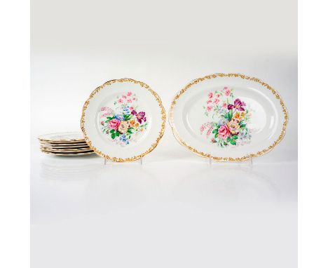 Bone china plates and oval shaped platter decorated with a multicolored bouquet in center and gold scroll scalloped edges. Ro