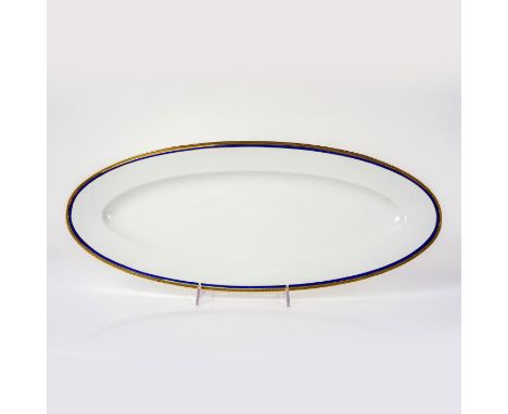 Long white platter with elegant cobalt blue ring and gold scroll design on the rim. Richard Ginori backstamp. Dimensions: 22.