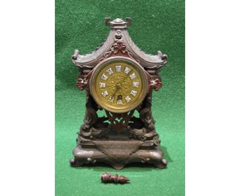 Oriental painted spelter mantle clock, the case in the form of a pagoda and having gilded metal dial with enamel character sy