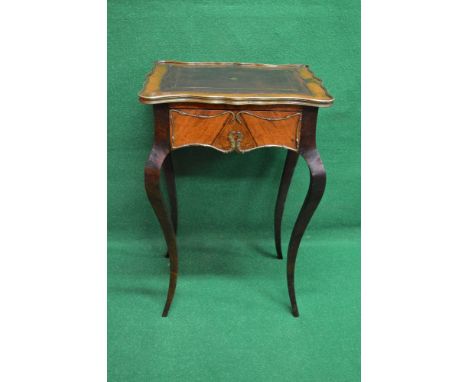 Walnut ladies occasional writing table having shaped top with brass border surmounting a red leather insert with gilt tool wo