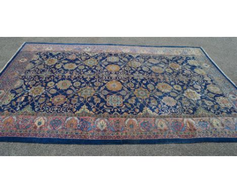Blue ground carpet having floral pattern and end tassels - 126" x 195"