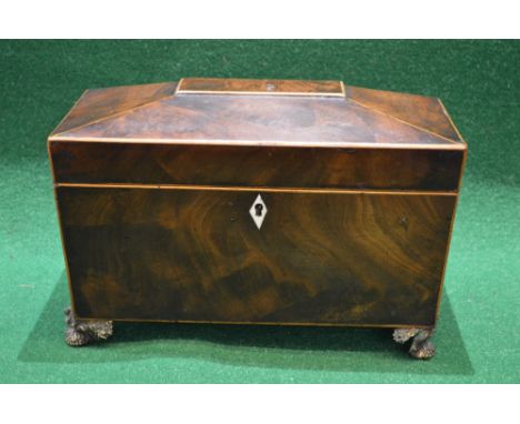 Mahogany inlaid tea caddy opening to reveal two section interior and having diamond shaped escutcheon, standing on brass feet