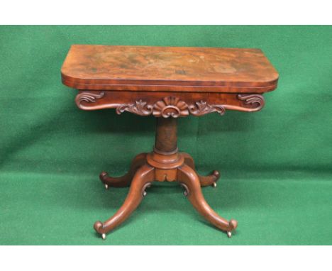 Victorian mahogany fold over card table having D shaped top opening to reveal circular red baize lined playing area, supporte