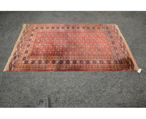 Red ground carpet having orange, blue and white pattern - 78" x 49.5"