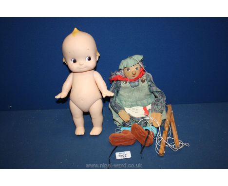 A Marionette Puppet and a Kewpie Doll