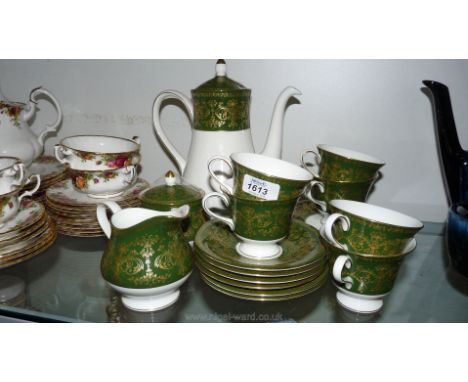 An elegant Wedgwood 'Harlech' green and gold Coffee Set including coffee pot, six each cups, saucers and tea plates, milk jug