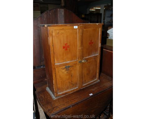 An arts and crafts, drag finished Pine Wall Cupboard of small proportions, pair of opposing two panel doors opening to reveal
