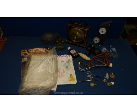 A quantity of miscellanea including Welsh spirit and liqueur miniatures, sewing patterns, quartz Metamec clock, shell, etc.