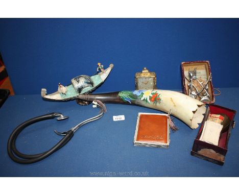 A box of miscellanea including clock, stethoscope, cigarette cards, pump, clippers, decorated horn, shell boat ornament, etc.