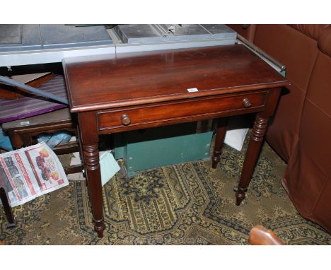 A reproduction Mahogany finished, Victorian style Side Table with moulded edges, over single frieze drawer, standing on turne