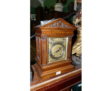A 19th c. cased Architectural Clock with thirty hour movement, brass and alloy face under bevel plated glass with fretcut, pi