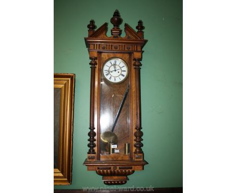A Walnut and other woods Vienna type Wall Clock having two train weight driven movement, striking on a gong, the brass bound 
