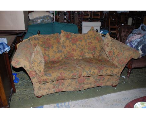 A modern Knoll style two seater Sofa having double drop arm, upholstered in rust coloured floral print fabric with two bolste