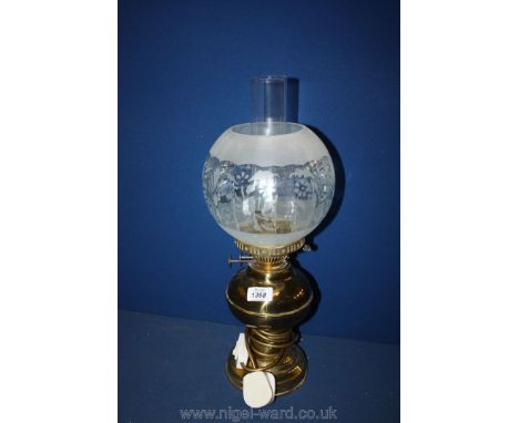 A converted Brass Oil Lamp to electric with glass shade