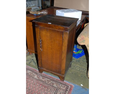 A 1940's Oak utility single panel door Washstand with cleated edge top and wooden handle, and enamel bowl, 20'' wide x 36'' h