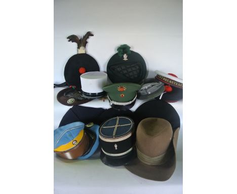 A selection of approximately 16 articles of 20th century European forces headwear to include a French Civil Militaria example