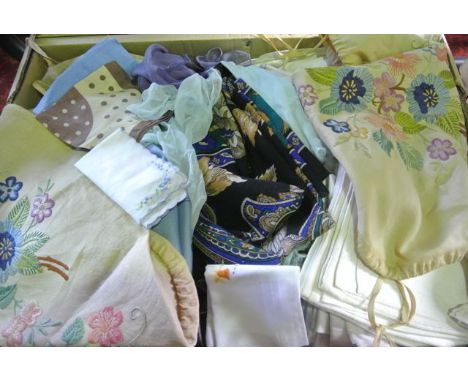 A box containing an assorted collection of vintage textiles to include ladies silk headscarfs, sections of linen with embroid