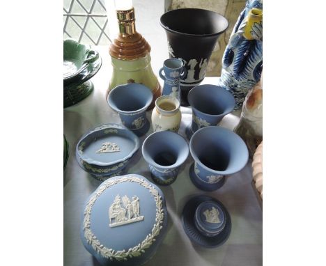 A Wade Scotch Whisky bell, a small Wade vase with printed decoration of a woman in crinoline dress, a collection of Wedgwood 