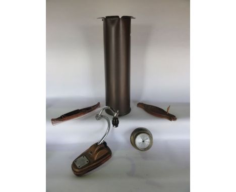 A large WWII brass shell case, an Art Deco desk light, a barometer and a model open boat
