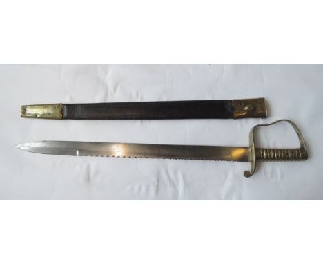 A 19th century Pioneer saw back sword by Wilkinson, the double edged blade with brass mounts, the scabbard black leather with