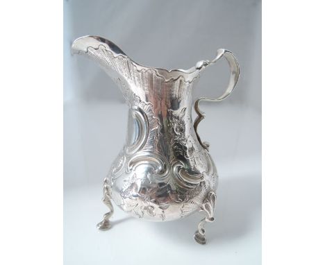 A William IV silver creamer, John Evans II, London, 1850, the bulbous body chased with flowers, leaves, C-scrolls, diapers an