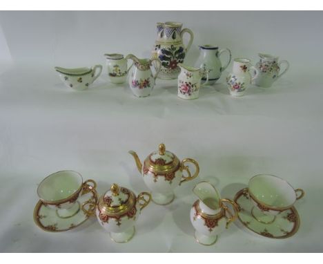 A collection of 19th century French cabinet wares in the Limoges manner comprising teapot, covered two handled sugar bowl, mi