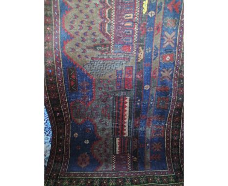 An Eastern wool rug with abstract geometric detail and set within alternating running borders 145 x 85cms