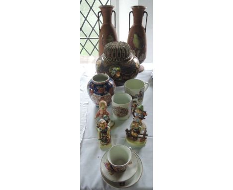 A pair of late 19th century Watcombe Torquay ware terracotta two handled vases with painted decoration of birds on blossom la