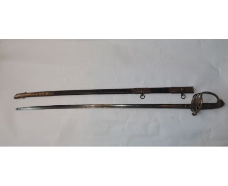 A Victorian infantry Officers Sword - 1845 pattern with brass mounts and fish skin grip, leather and brass mounted scabbard, 