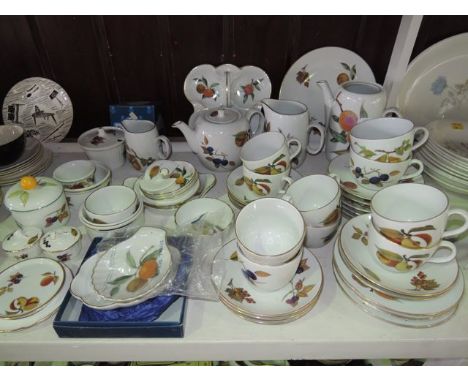 A quantity of Royal Worcester Evesham pattern oven-to-table wares including a trefoil shaped dish, teapot, coffee pot, two gr