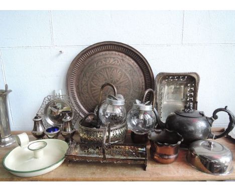 A late 19th century silver plated teapot of bulbous form and fruit shaped finial lid, a copper tray of circular form with wor