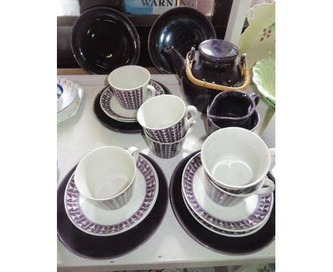 A collection of Swedish Variant Percy pattern tea wares with dark aubergine coloured glaze and geometric type decoration comp