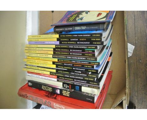A collection of Modesty Blaise books by Peter O'Donnell together with a number of vintage boys annuals from the 1970's and ea