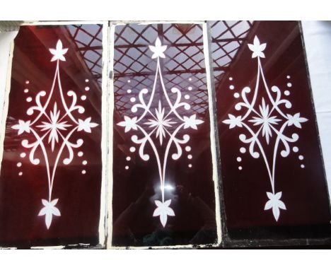 Three late 19th century/early 20th century ruby coloured glass panels of rectangular form, all with clear cameo cut symmetric