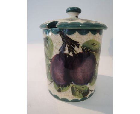 A Wemyss preserve pot and cover with painted purple damson and green leaf decoration, with impressed Wemyss mark to base, 12 