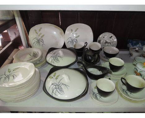A collection of Midwinter Stylecraft fashion shape dinner wares in the Bali-Hai pattern comprising a pair of covered tureens,