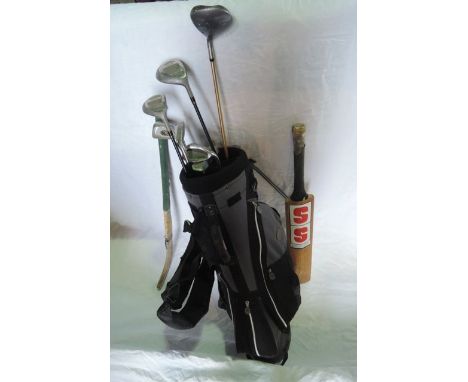 A contemporary golf bag containing a selection of seven golf clubs to include examples by Spalding, Power Bilt, a timber Stua